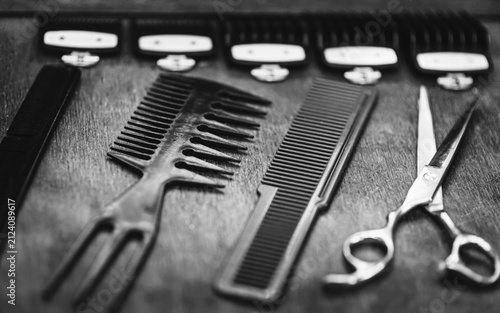 combs and scissors for haircuts lie on a shelf in the cabin