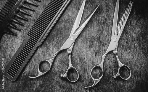combs and scissors for haircuts lie on a shelf in the cabin