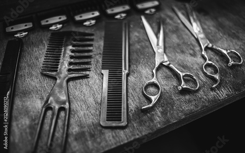 combs and scissors for haircuts lie on a shelf in the cabin