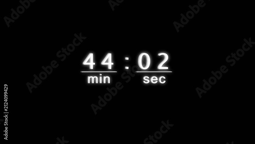 Neon digital display counting down forty four minutes and two seconds on dark background.