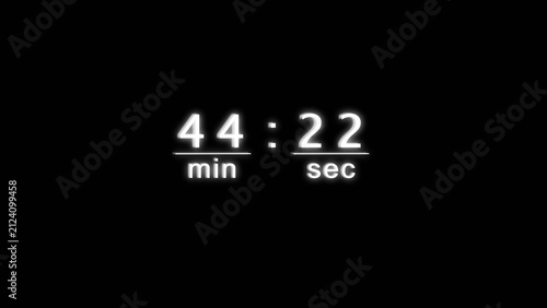 White neon digital clock displaying forty four minutes and twenty two seconds on black.