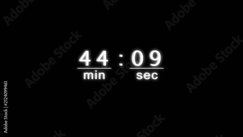 Glowing electronic timer showing forty four minutes and nine seconds on black backdrop.