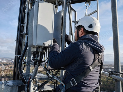 Telecom Engineer Inspecting 5G Tower