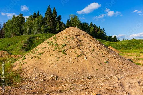 Cuadro en lienzo Large pile of raw natural sand situated in a rural quarry, featuring gravelly te