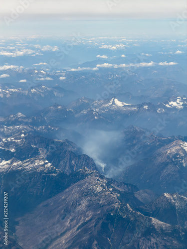 Areal view of wildfire smoke in mountains in Washington State from a commercial airplane window over the North Cascade Mountains on July 29, 2026