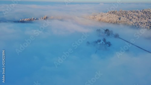 Majestic Aerial View of Foggy Winter Landscape at Golden Hour