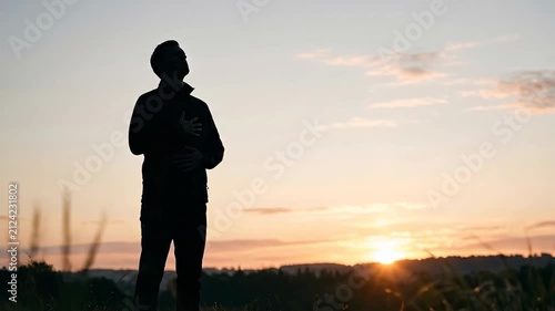 Man silhouette standing at sunset 4K Video
