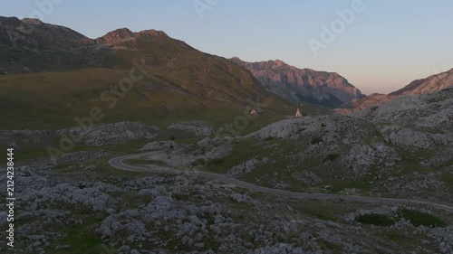 Drone Flying Through a Rocky Mountain Valley at Golden Hour