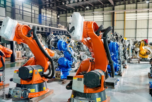 Robotic arms in a factory setting for assembly and manufacturing tasks