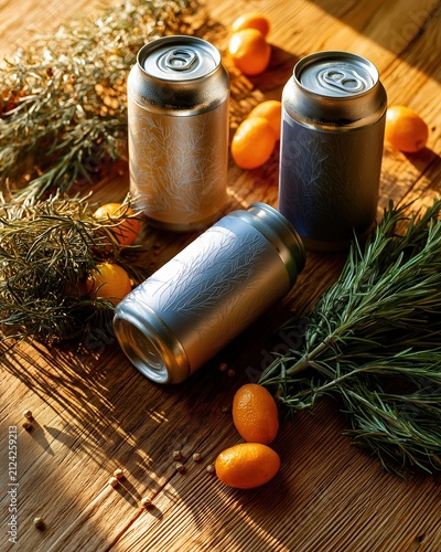 Cold craft beverage cans with embossed botanical patterns on a wooden table. Refreshing sparkling drink mockup with fresh rosemary and citrus fruits in warm golden hour sunlight