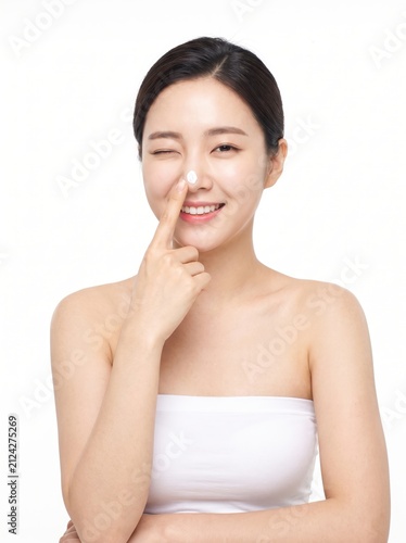 Smiling Woman Applying Skincare Cream with Joyful Expression