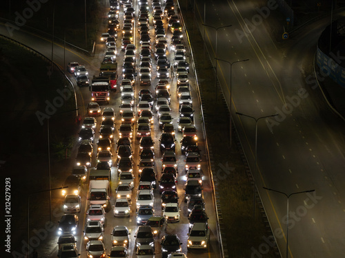 Фотография High-altitude aerial view of a massive nighttime traffic jam with hundreds of vehicles on a multi-lane highway