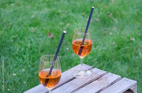 Two glasses of Aperol Spritz during a summer party