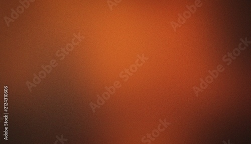 Orange and brown textured background with soft gradient light for Halloween themes during autumn