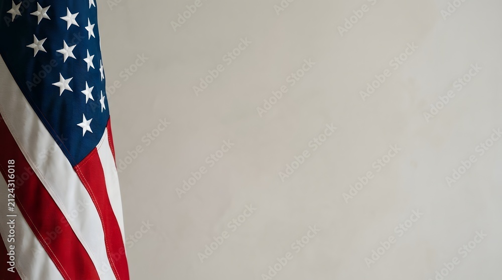 Obraz premium American flag subtly on left edge against a clean soft lit background with large negative space for copy.