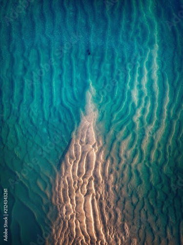 Photography Spectacular aerial view of turquoise water surrounding a natural sandbank with mesmerizing textures