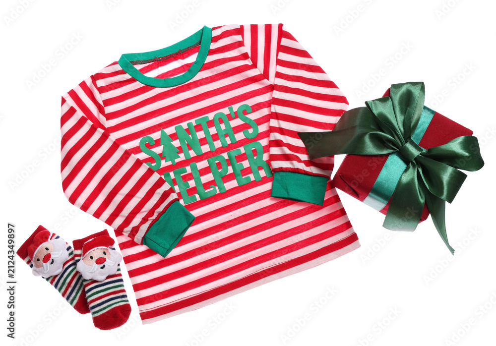 Fototapeta premium Christmas baby clothes. Sweater with phrase Santa's helper, socks and gift box on white background, top view