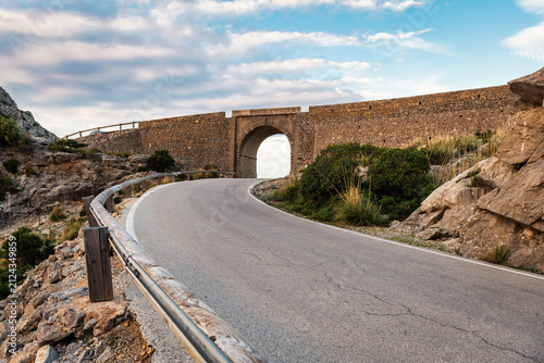 Ancient wall with road and arch on mountain top