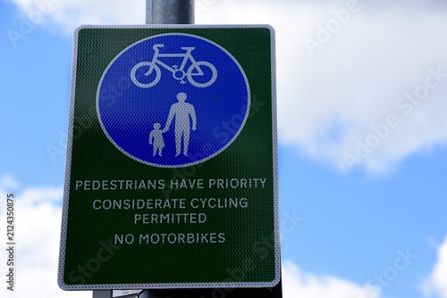 Sign on a pathway. Pedestrians have priority. Considerate cycling permitted. No MotorBikes.