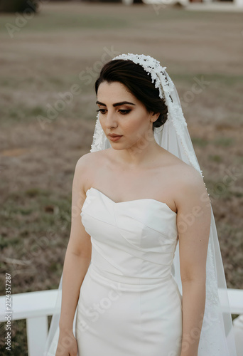 Young bride in a white stra...