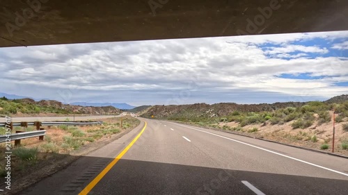 Driving Under An Overpass Bridge In California On US 395 Driver Point Of View