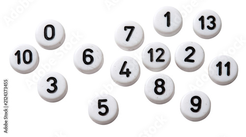Fotografie Scattered white plastic numbered beads with black digits on a transparent backgr