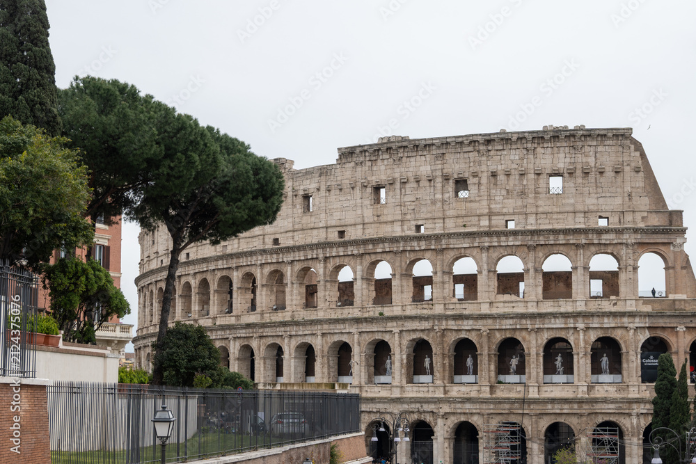 Obraz premium Architectural history in details of ruins, old buildings, walls, amfitheatres, arches in old part of Rome, dated from 300 BC, guided tours in Rome, Italy