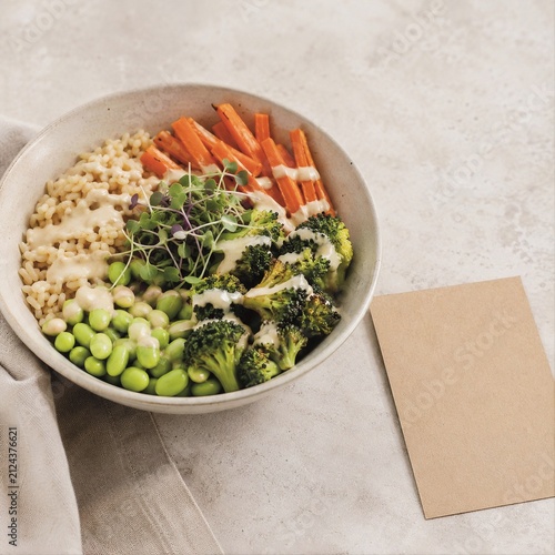 Healthy Vegetarian Buddha Bowl with Rice, Broccoli, Edamame and Carrots