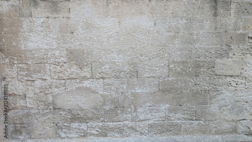 Obraz na płótnie Weathered limestone ashlar wall texture in warm natural light