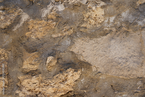 Weathered Natural Stone Wall Texture Background with Rough Limestone Surface