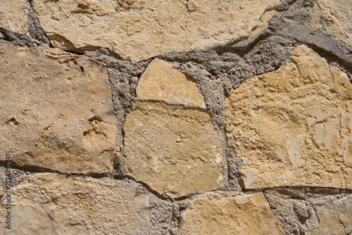 Rustic Limestone Stone Wall Texture Background with Natural Earth Tones