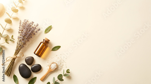 a bunch of flowers and a bottle of essential oil on a white background