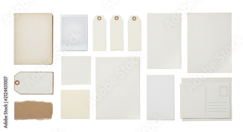 Flat lay of blank vintage paper elements including a notebook and polaroid on a transparent background with copy space. Concept of nostalgia and creative process