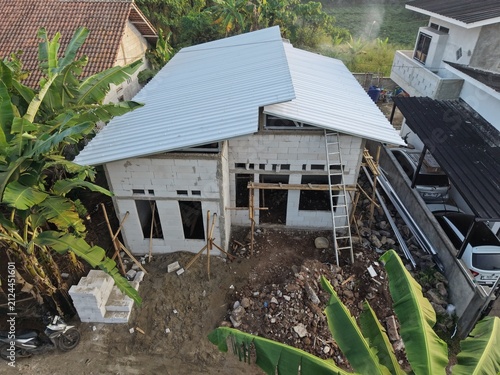 Residential Construction Site with Concrete Building and Metal Roof