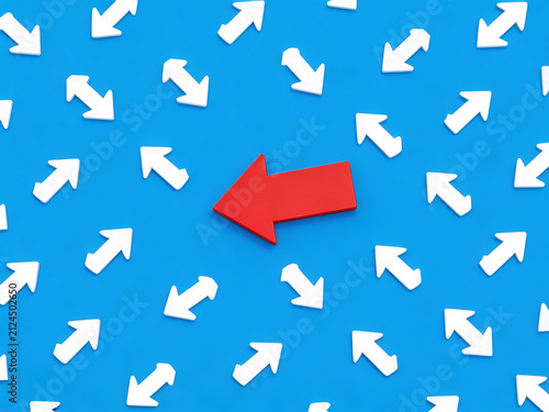 Red arrow pointing left among white arrows