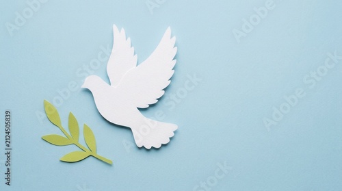 White paper cut dove bird flying with green olive branch on light blue background, representing international peace and harmony, ideal for greeting cards and religious or spiritual concept designs