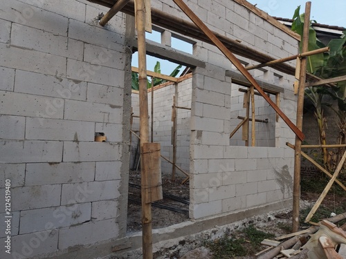 Construction Site with Concrete Walls and Bamboo Scaffolding
