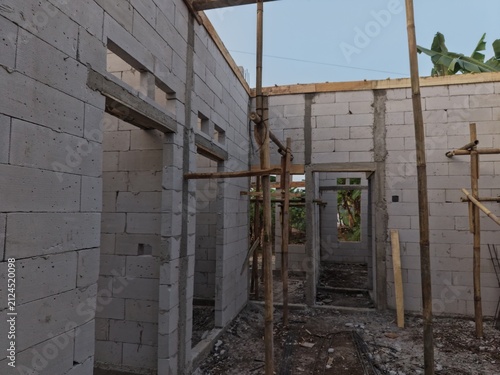 Construction Site: Unfinished Brick Building with Scaffolding
