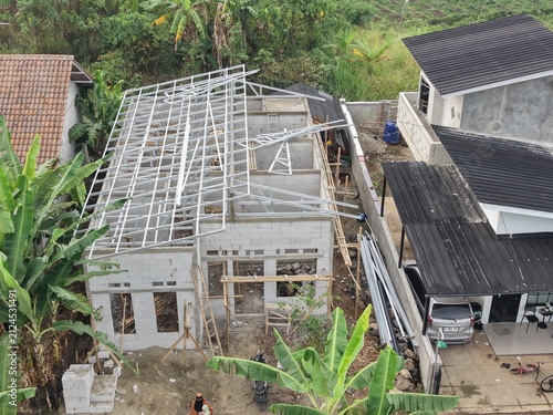 Under Construction: Roof Frame Installation on Residential Building in Tropical Area
