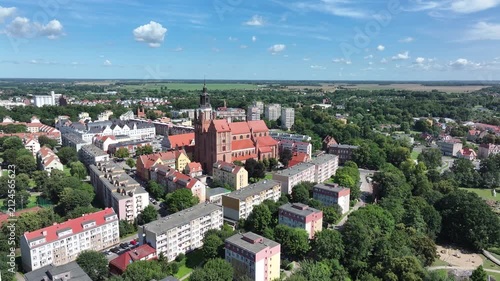 Stargard Poland city church square pull 2. Northern Poland in 8th century. Historical stronghold, defensive walls, gates towers. WW II POW camp controlled by Germany. Brick church.