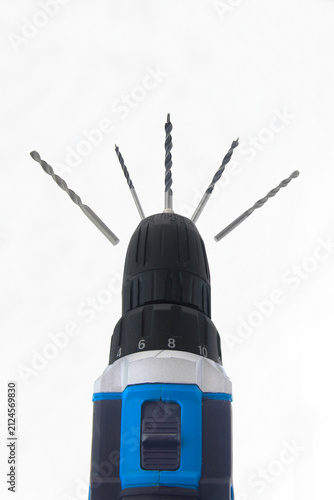 Canvas Print Powerful drill with multiple bits protruding upward