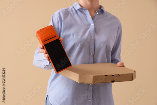 Delivery person holding a p...