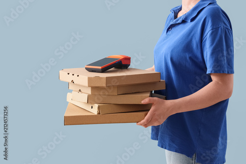 Delivery person in blue uni...