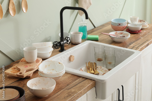 Messy kitchen sink and coun...