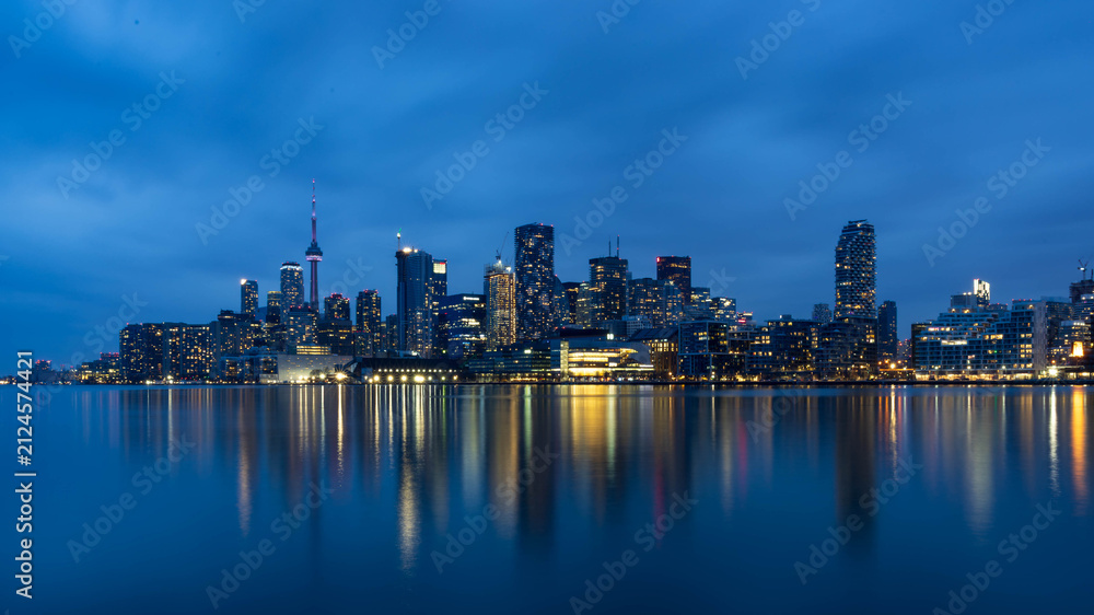 Fototapeta premium Toronto Skyline Reflected on Lake Ontario at Blue Hour, Ontario, Canada