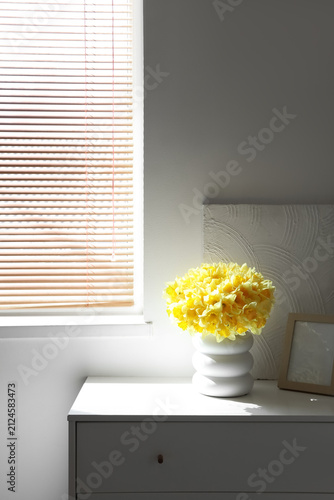 Vase with daffodils, frame ...