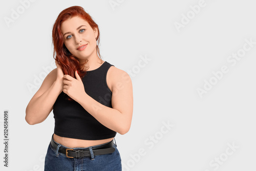 Cute young redhead woman on...