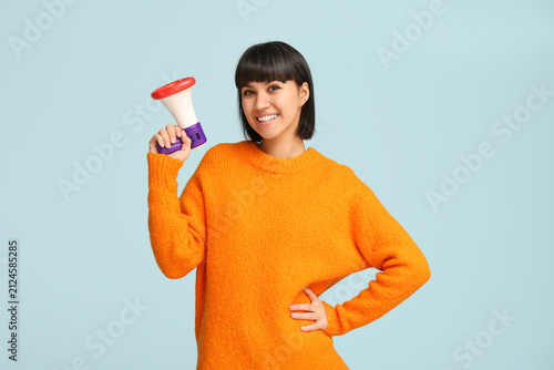 Young woman with megaphone ...