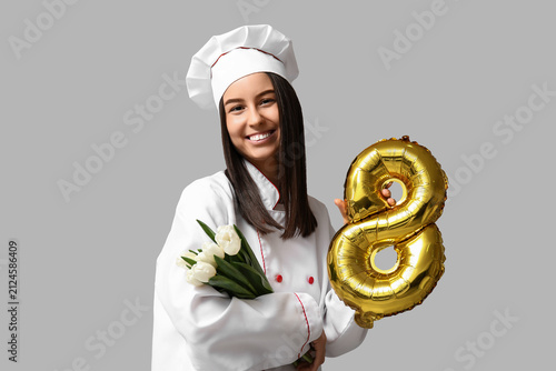 Female chef with tulips and...