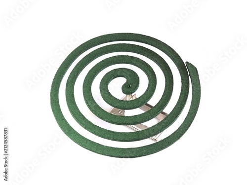 A mosquito coil placed on a metal stand. Photographed against a white background.